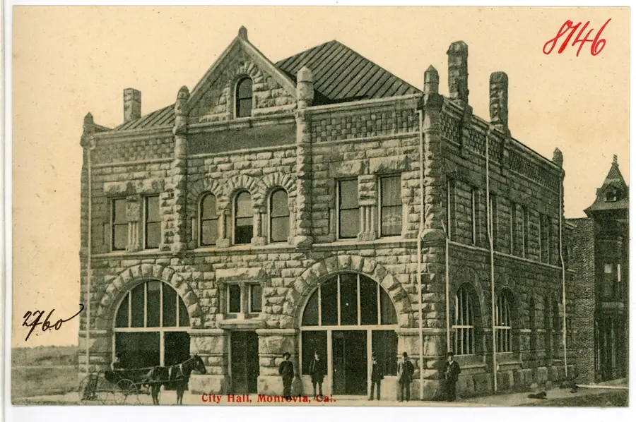 Old sepia photo of the ornate stone Monrovia City Hall from 1906