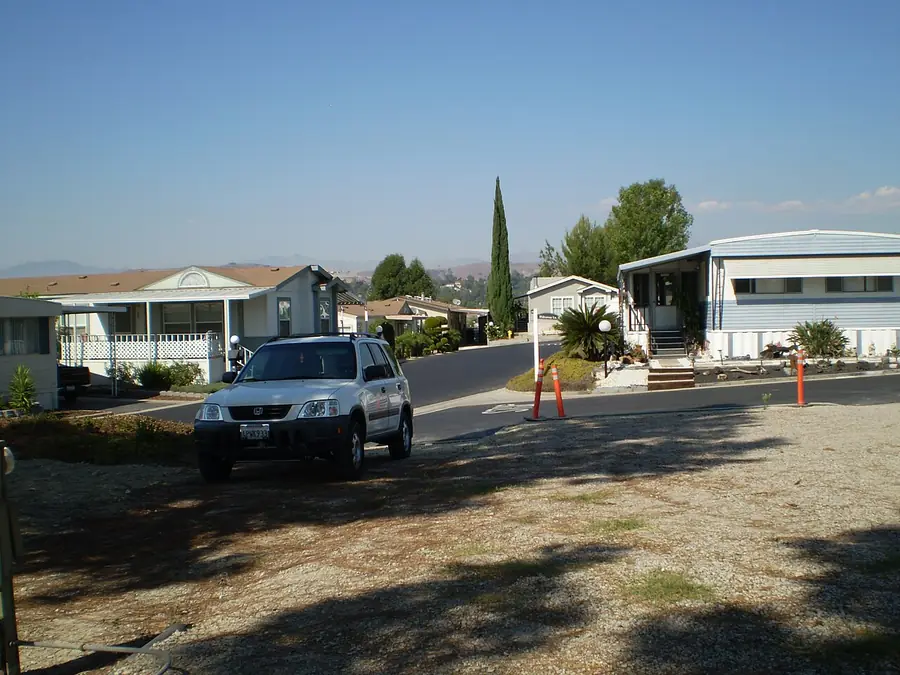 Residential street with homes and a parked pickup truck in West Covina