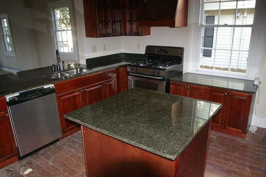 Kitchen island with a range hood above the stove