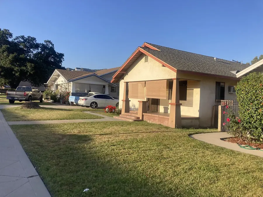 Craftsman style house with a front porch on a quiet Azusa street