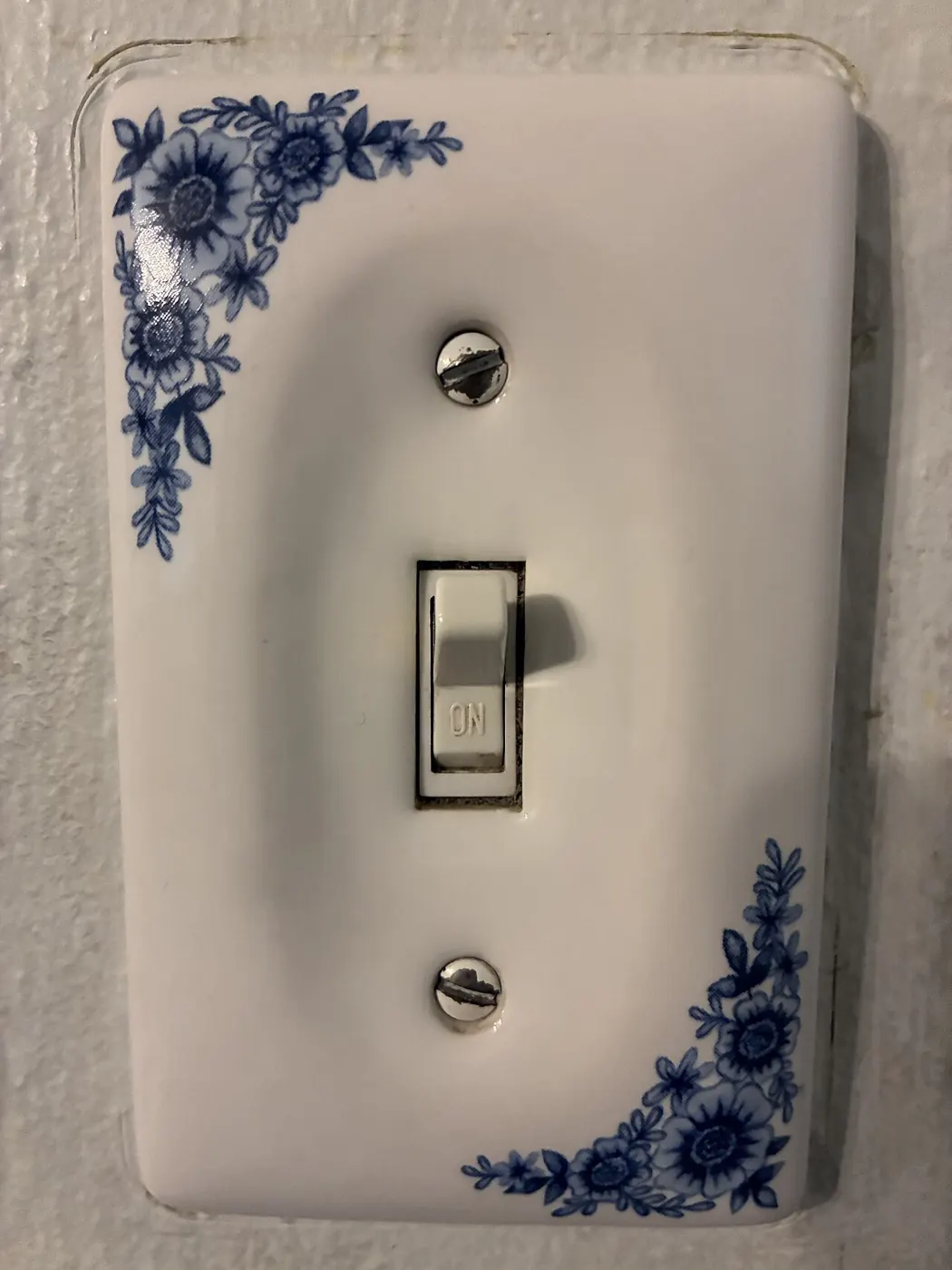 Wall light switch in the on position