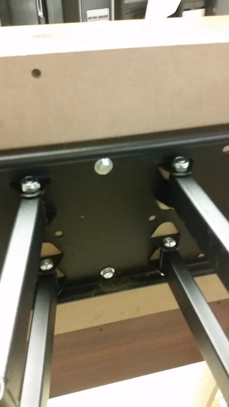 Metal TV wall mount bracket fixed to a wall