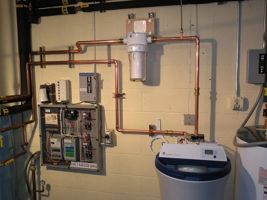 Water softener and filter piped into copper lines in a basement