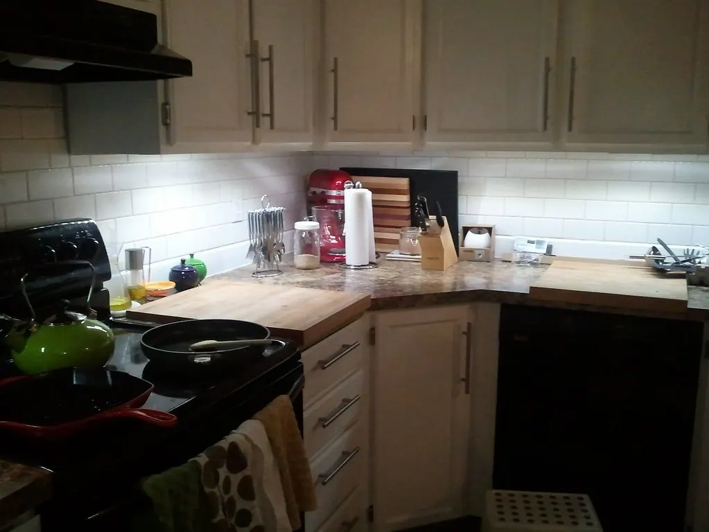 Newly installed lights under kitchen wall cabinets over the counter
