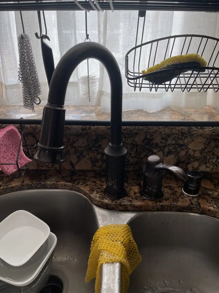 Matte black kitchen faucet installed on a granite counter
