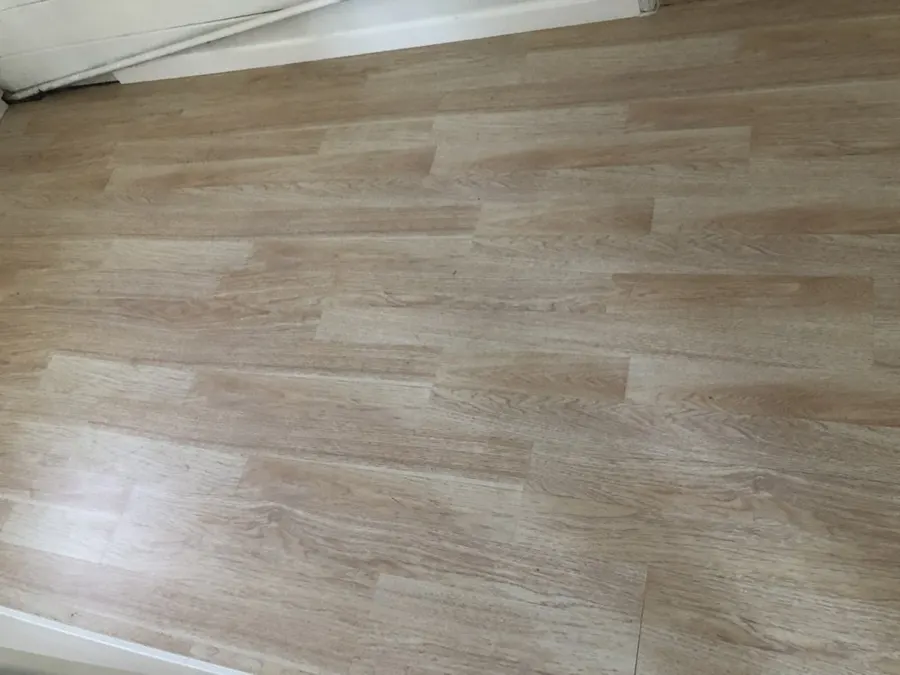 Close view of light oak-look vinyl planks after installation