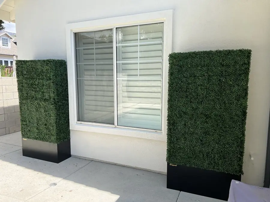 White vinyl window set in a stucco wall with the trim sealed